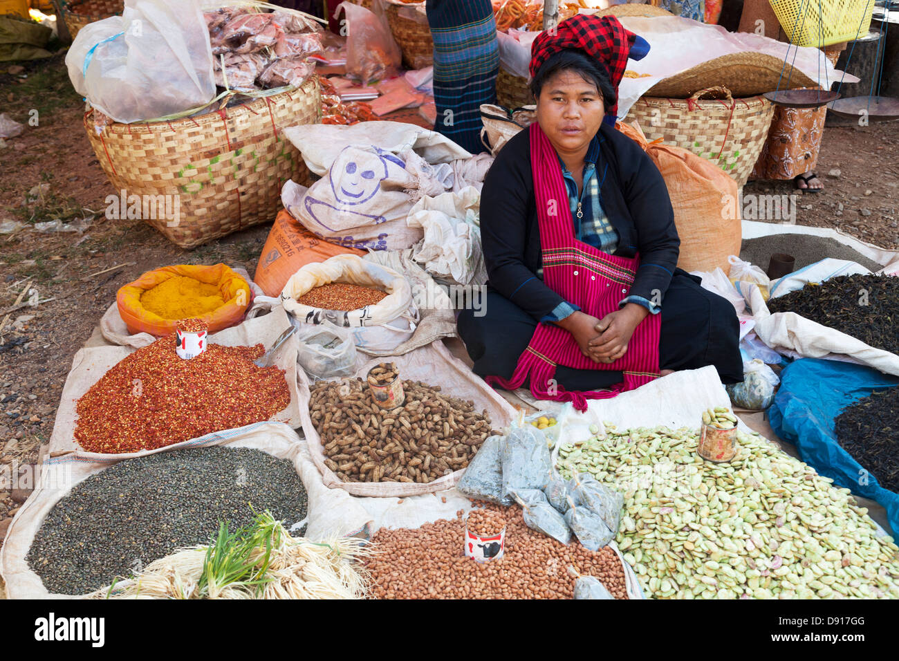 Woman selling nuts and spices on market day at a small village by Lake Inle, Myanmar Stock Photo