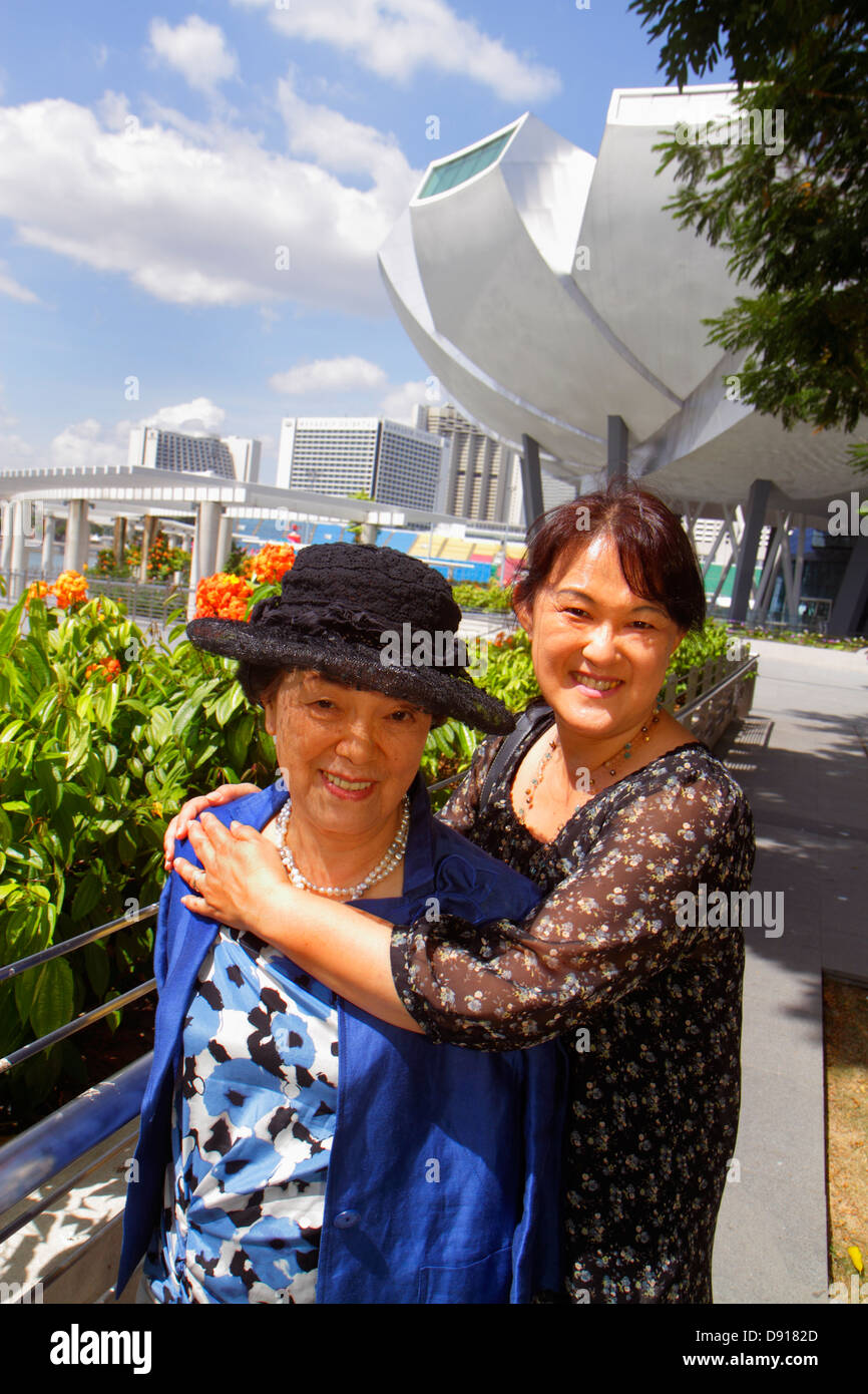 Singapore,ArtScience Museum,Asian Asians ethnic immigrant immigrants minority,adult adults woman women female lady,mother mom,parent,parents,adult dau Stock Photo