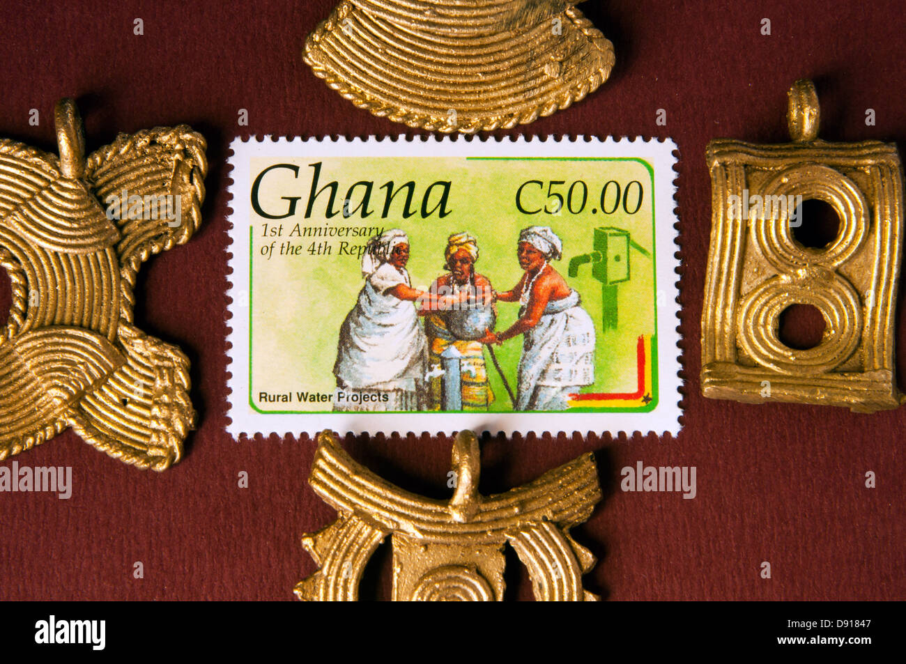 bronze symbolic images and postage stamp, ghana, in studio setting