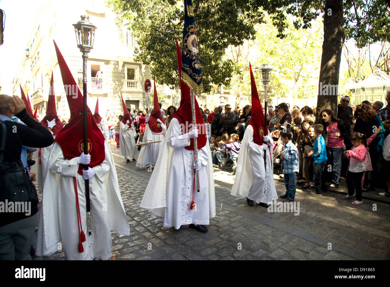 Processions in the streets with traditional costumes for the Catholic Festival of Semana Santa, Cadiz, Andalucia, Spain. Stock Photo