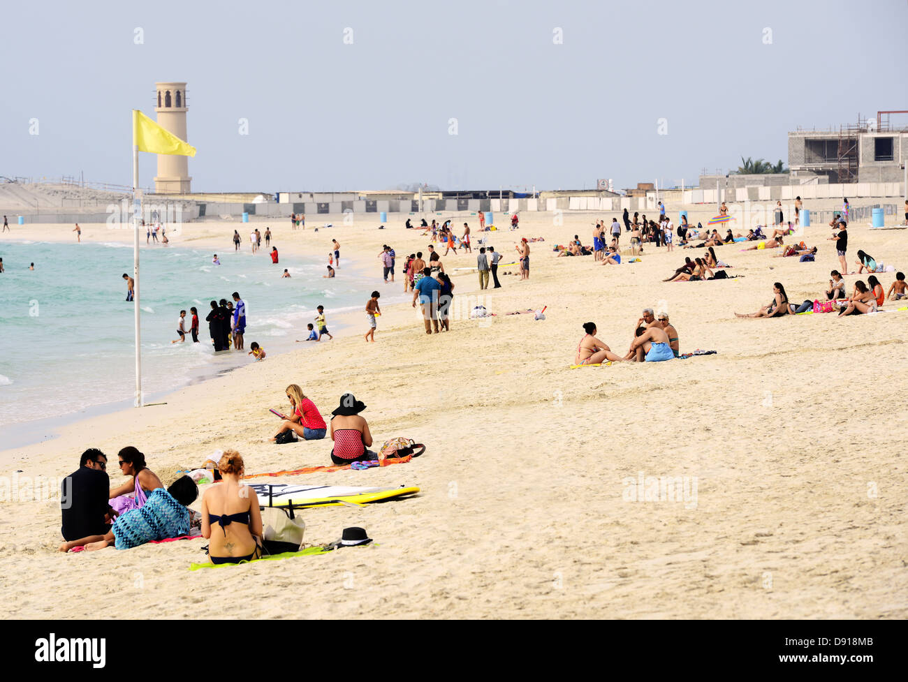 Dubai beach, tourists and locals at the beach in Dubai, United Arab Emirates Stock Photo