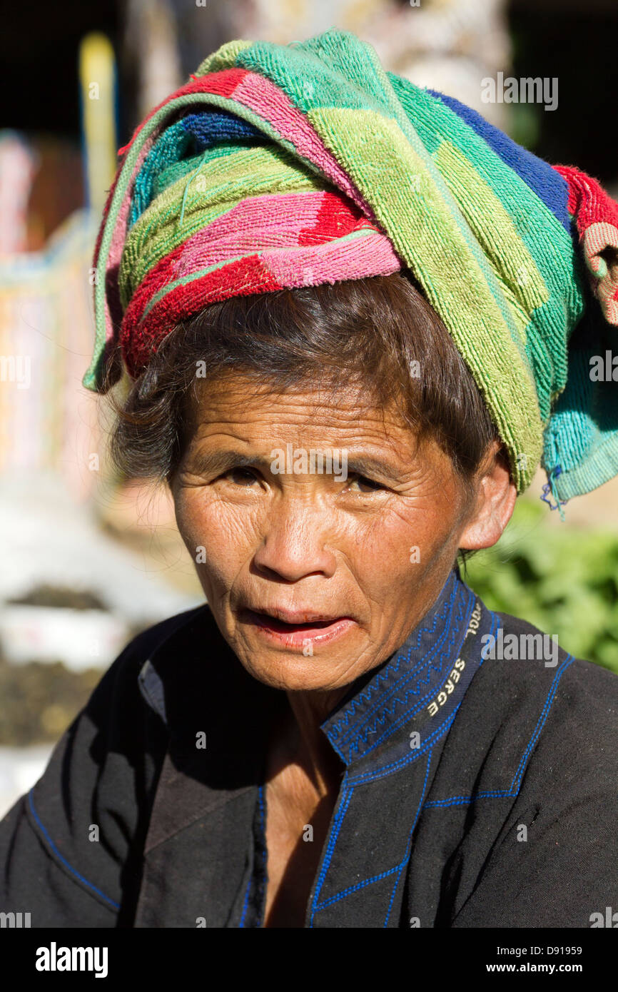 Colourful old woman on market day at a small village by Lake Inle ...