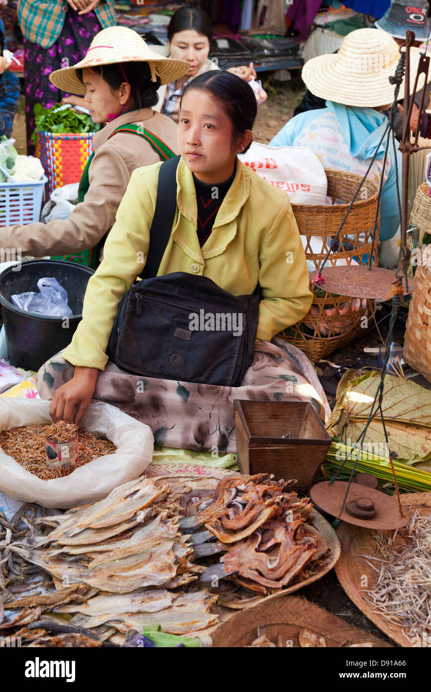 Woman selling dried fish, market day at a small village by Lake Inle, Myanmar Stock Photo