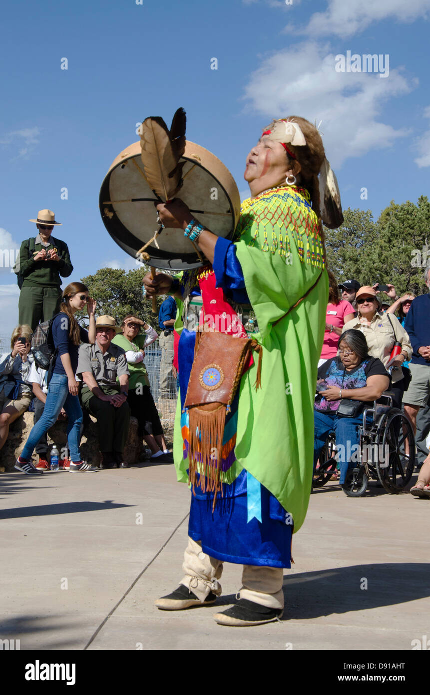 Dianna Sue Uqualla, representating the Havasupai people provides a traditional welcome and helps dedicate the renovated Bright Angel Trailhead during the dedication and ribbon cutting on May 18, 2013. The Bright Angel Trail is one of the oldest and best known trails in the National Park system. This renovation encompasses a 3.5 acre area at and surrounding the Bright Angel Trailhead and is focused on creating an accessible and comfortable area for visitors that complements existing historic buildings. Stock Photo