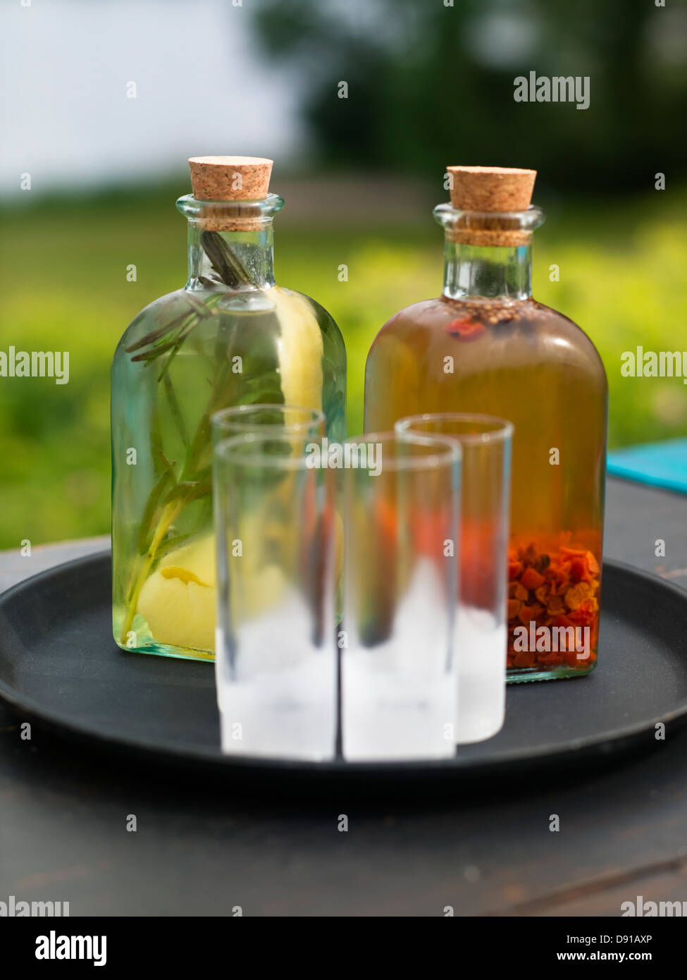 Bottles of snaps on a tray, close-up. Stock Photo