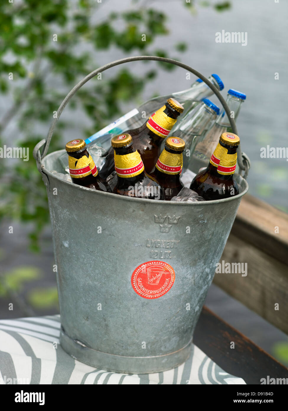 Ice bucket cold beer features Stock Photo - Alamy