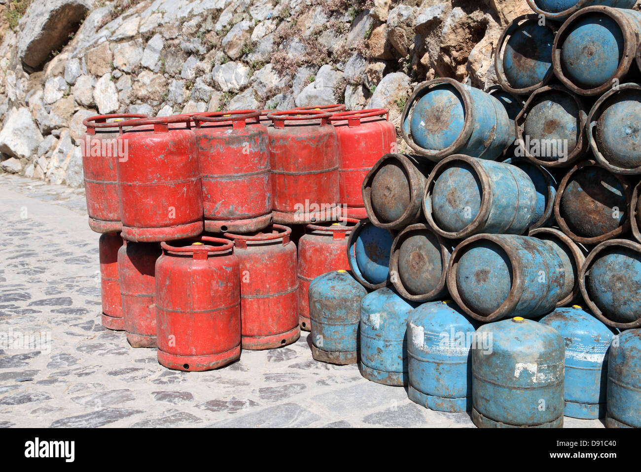 Red and blue propane gas bottles in Morocco Stock Photo