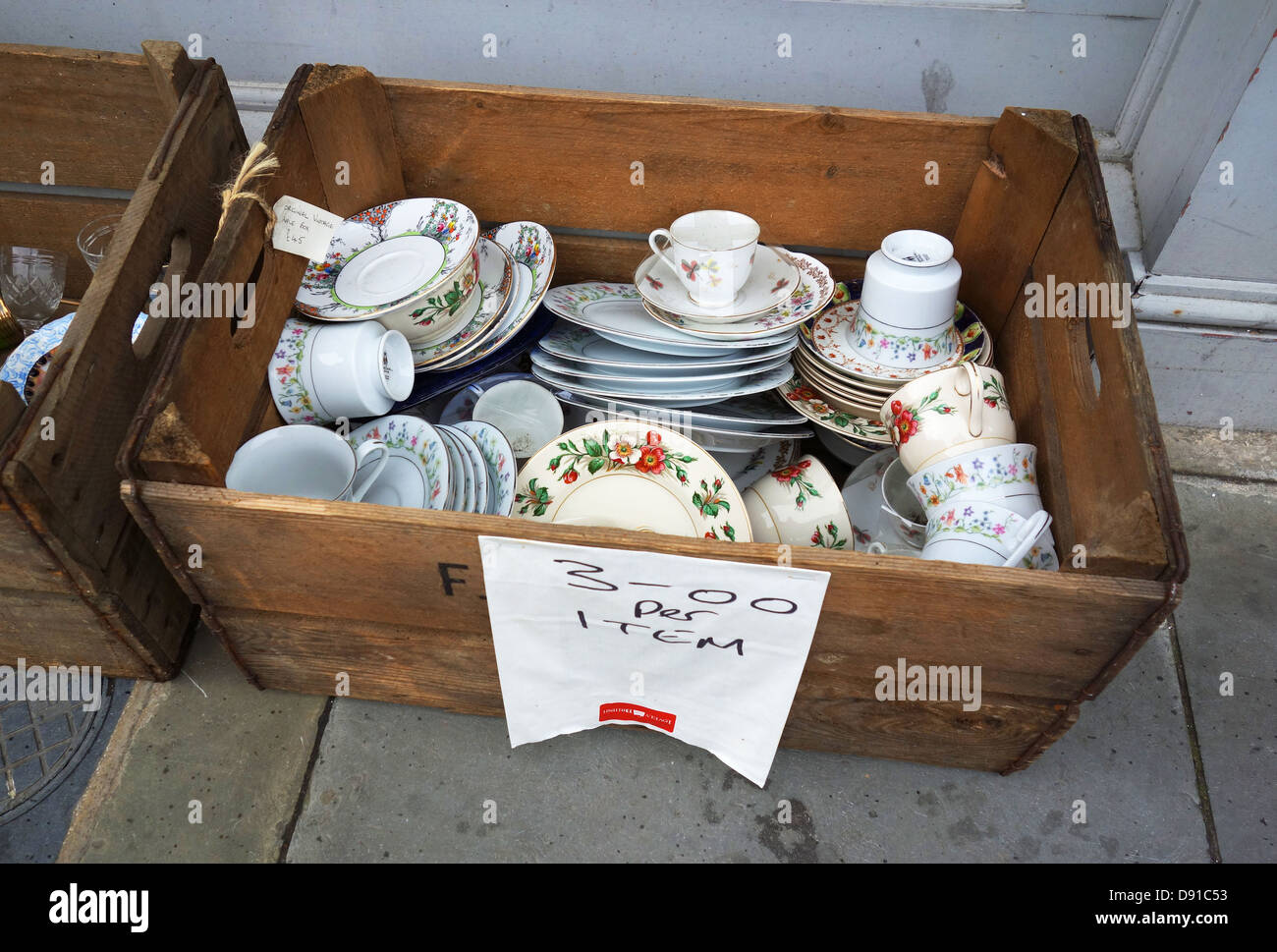 Crockery, Cups, saucers and plates for sale outside a shop, UK Stock Photo