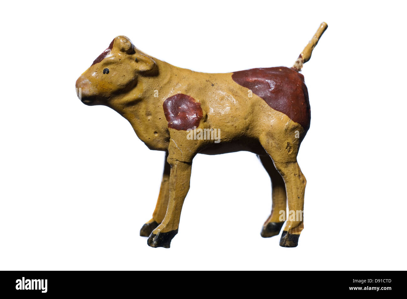 Figurine of cow against white background Stock Photo