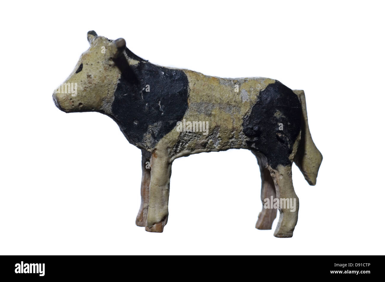 Figurine of cow against white background Stock Photo