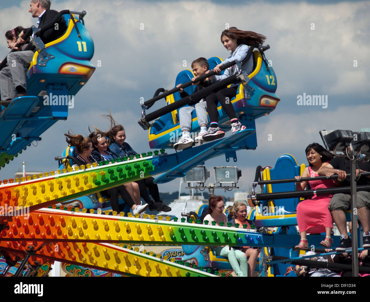 People enjoying themselves on an amusement ride on Brighton Pier Stock ...