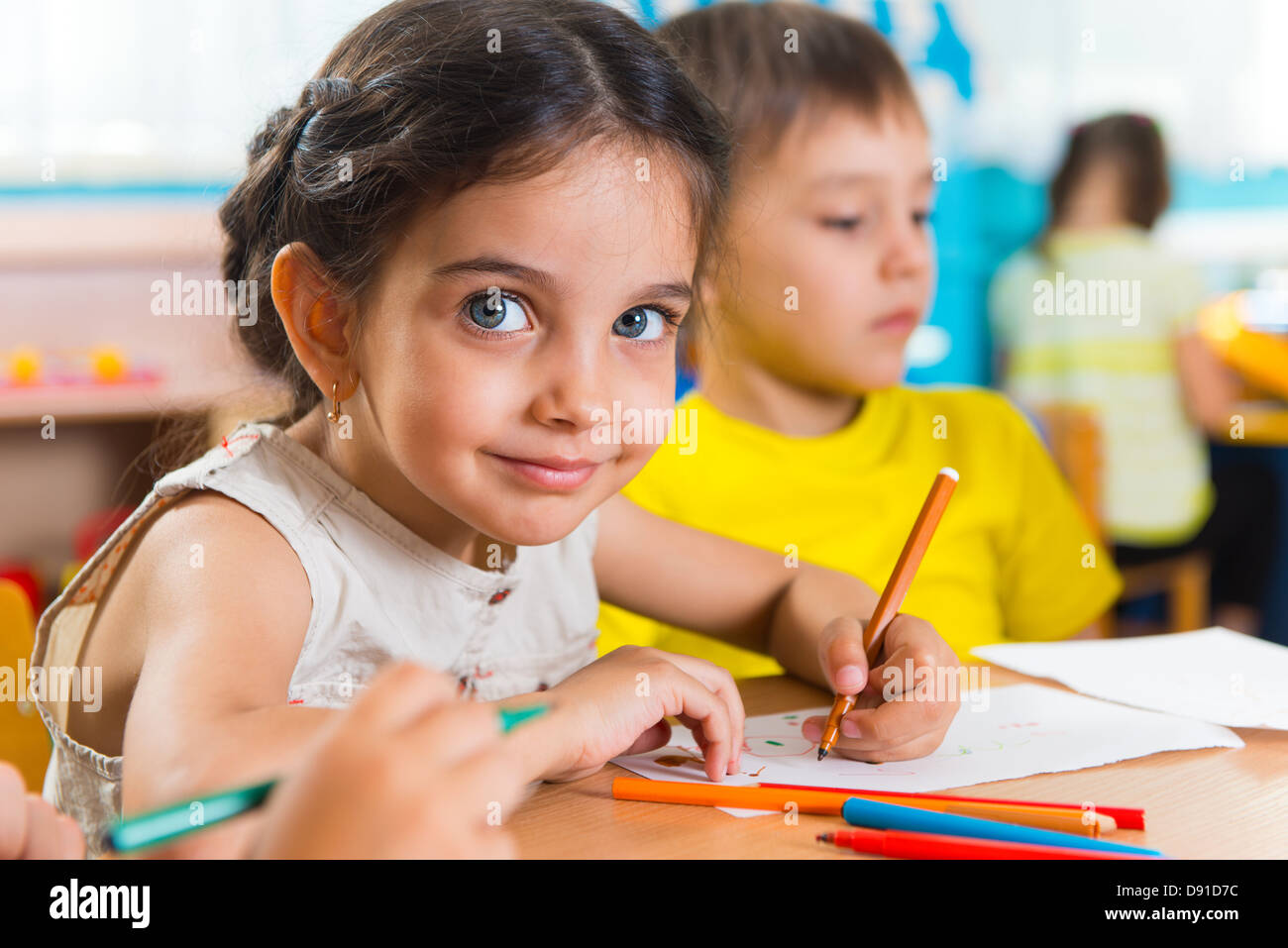 Group of cute little preschool kids drawing with colorful pencils Stock ...