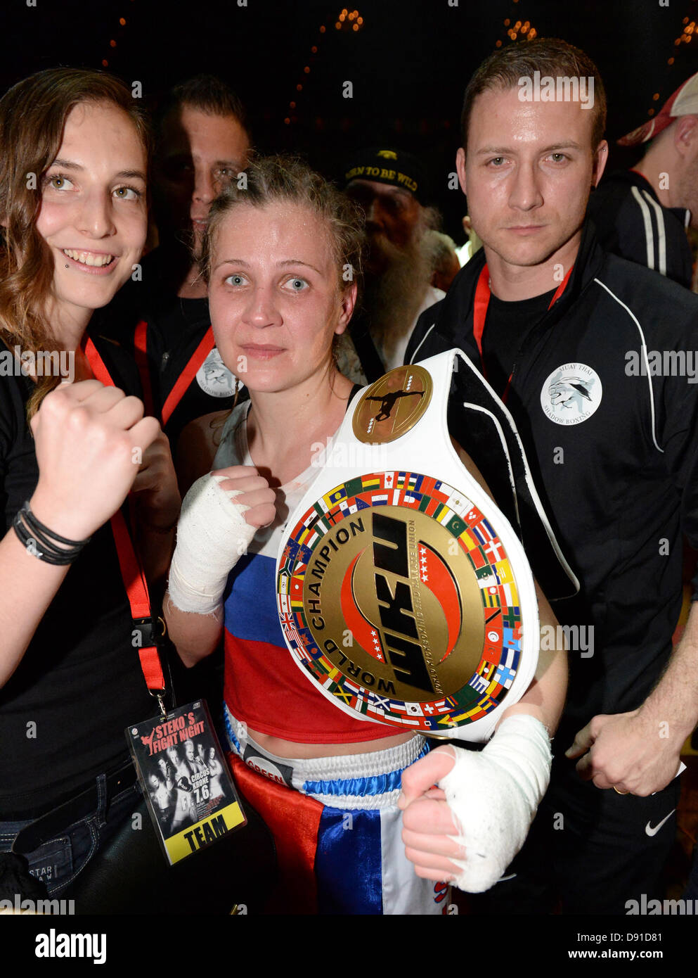 Kick boxer Olga Stavrova (C) from Russia wins the fight against Germany ...