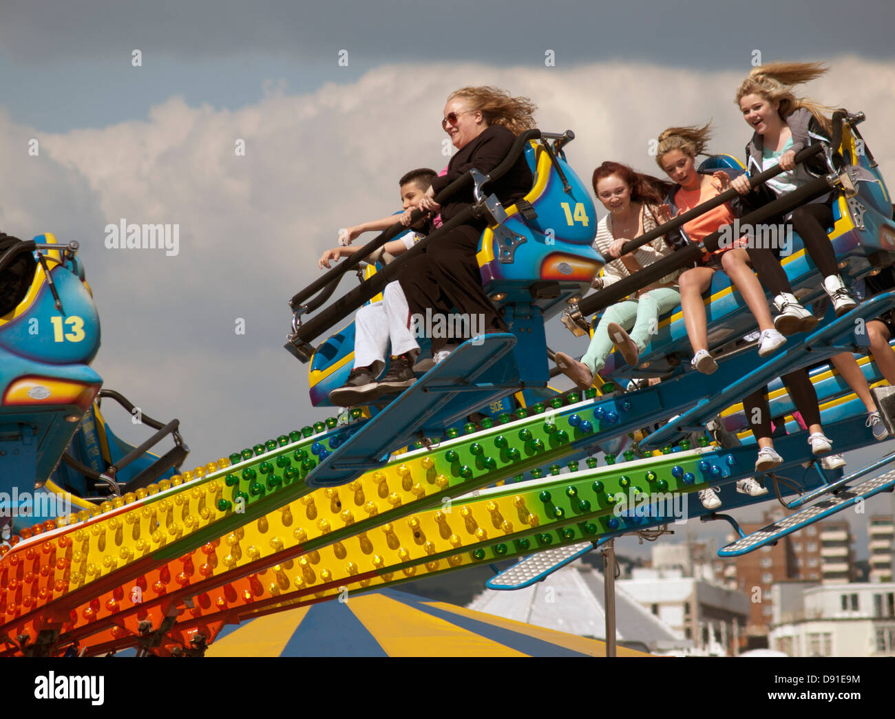 People enjoying themselves on an amusement ride on Brighton Pier Stock ...