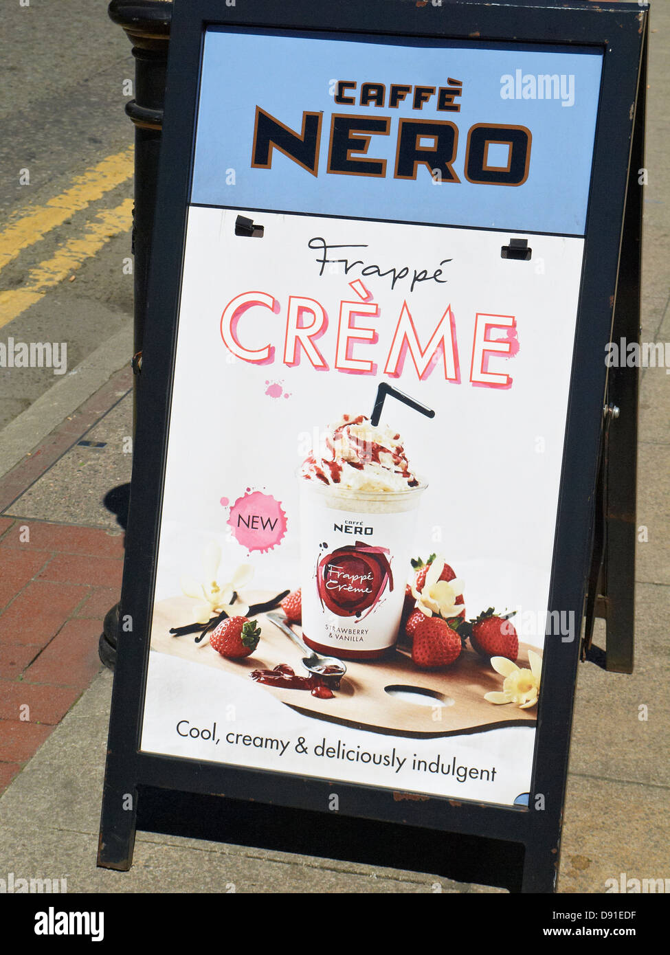 Cafe Nero advertising board on pavement UK Stock Photo