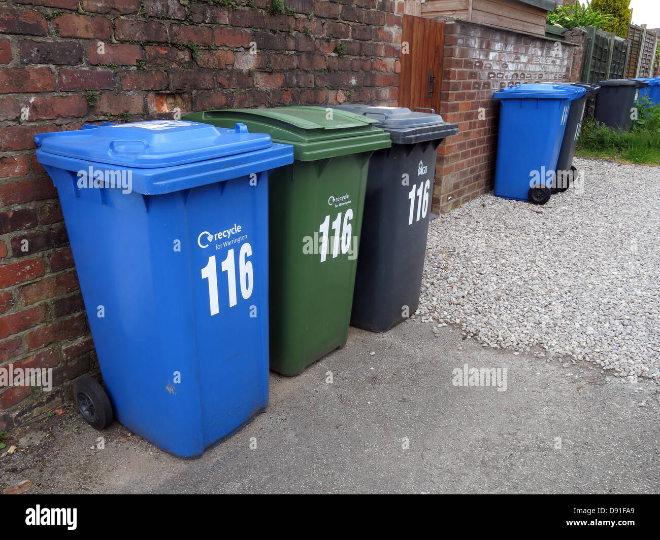 The many wheelie bins now required for domestic households in England, UK Blue for recycling, Green Garden Waste, Grey remainder Stock Photo