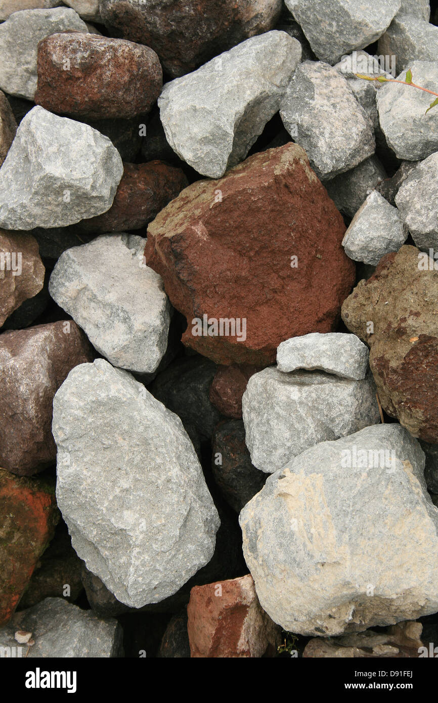Colorful rocks in various sizes and shapes at a construction site in ...