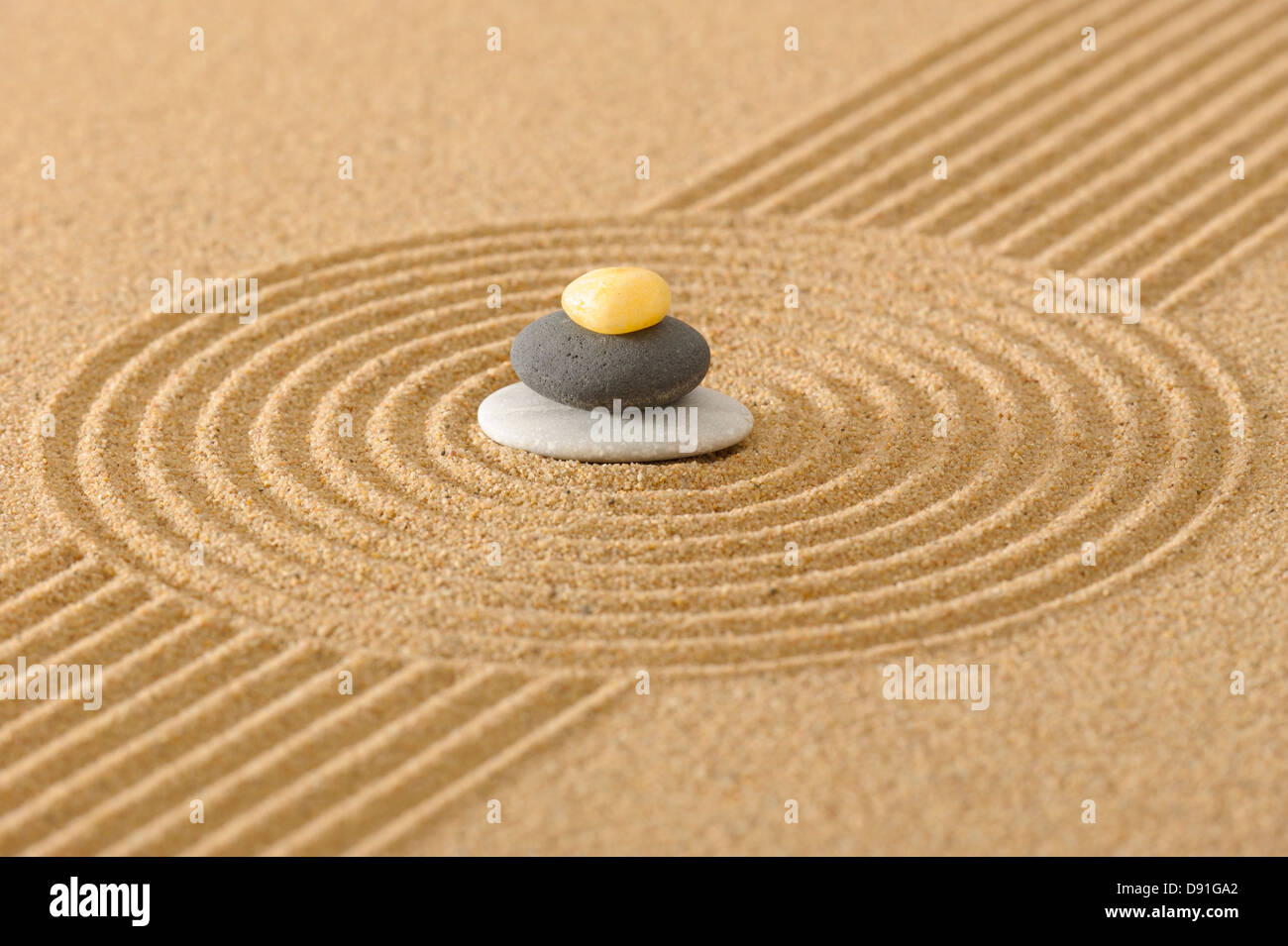 ZEN garden in sand with stacked stones Stock Photo Alamy