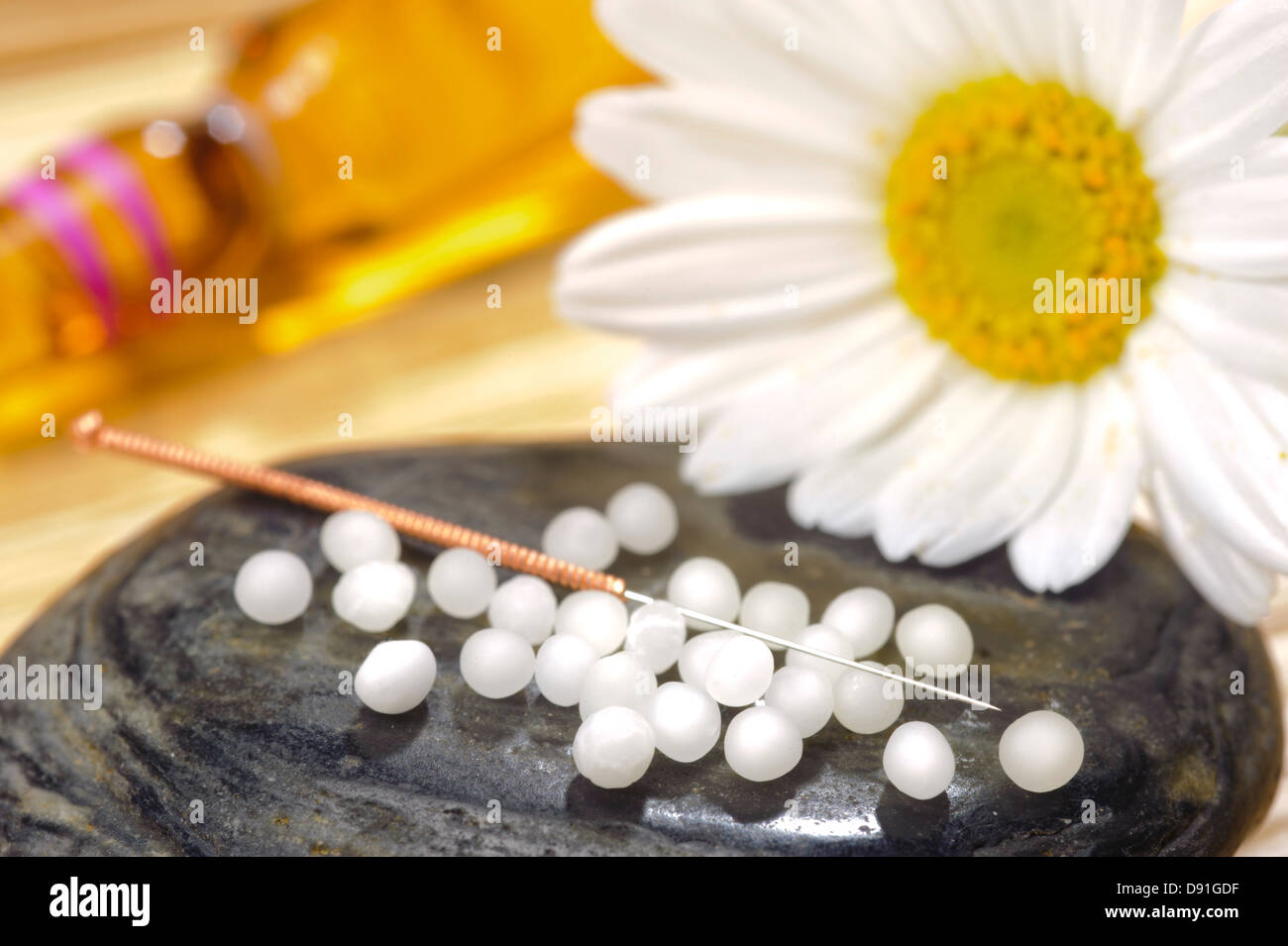 alternative medicine with herbal pills and acupuncture Stock Photo