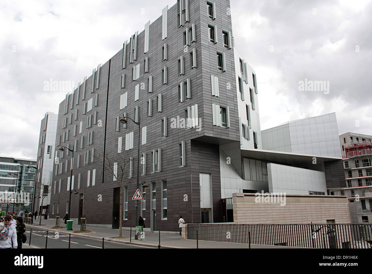 Paris, Apartment building incorporating nursery school at intersection of rue Jean Chauvin & rue des Grands Moulins. Stock Photo