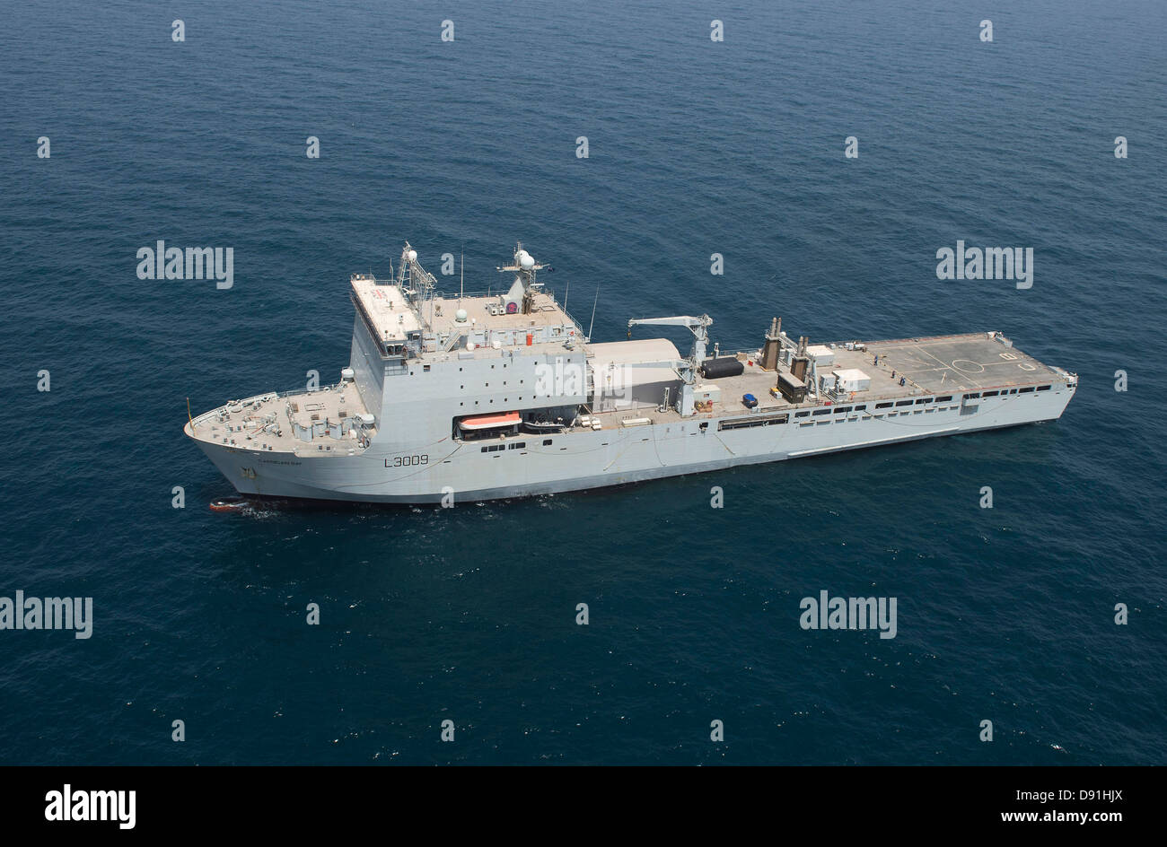 The British Royal Navy Fleet Auxiliary landing dock ship RFA Cardigan Bay maneuvers into a position during an International Mine Countermeasures Exercise May 20, 2013 in the Persian Gulf. Stock Photo