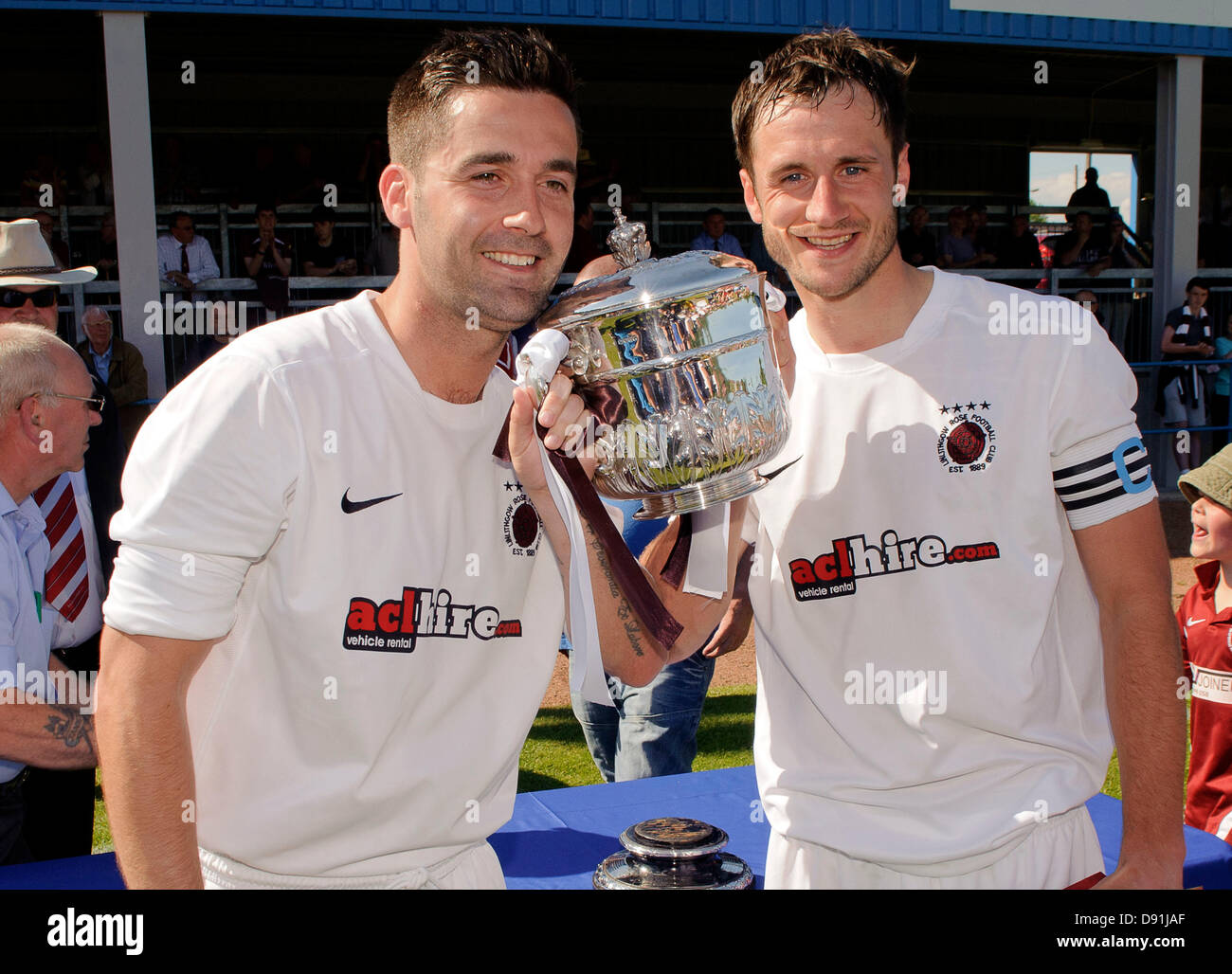 Bathgate, West Lothian, Scotland, UK. Wednesday 5th June 2013. Adam Nelson and Mark Tyrell lift the cup during the Fife & Lothians Cup Final, Linlithgow Rose v Camelon at Creamery Park, Bathgate. Credit: Colin Lunn Stock Photo