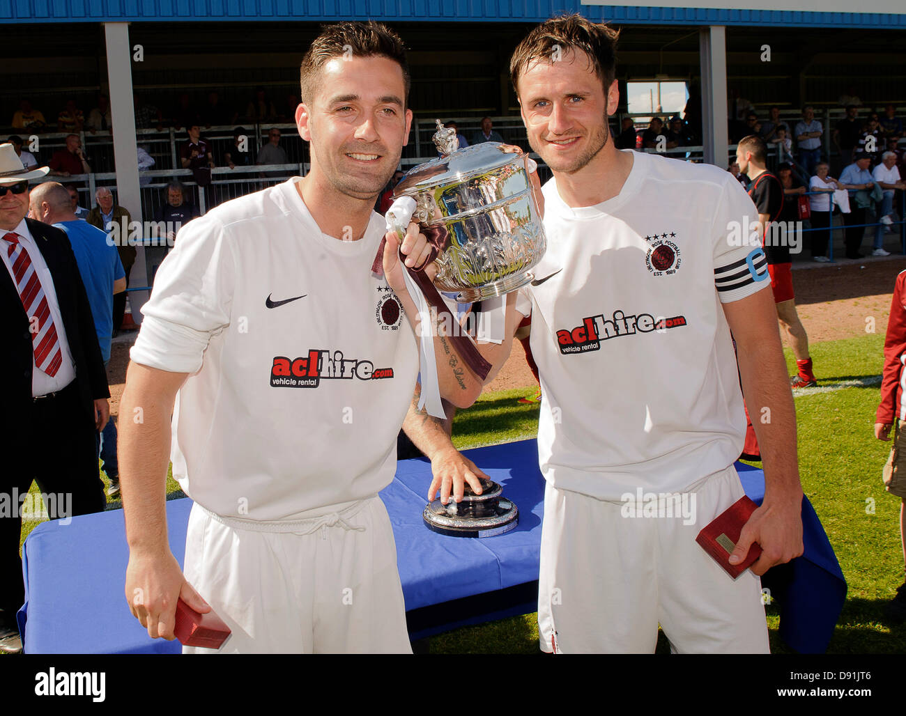 Bathgate, West Lothian, Scotland, UK. Wednesday 5th June 2013. Adam Nelson and Mark Tyrell lift the cup during the Fife & Lothians Cup Final, Linlithgow Rose v Camelon at Creamery Park, Bathgate. Credit: Colin Lunn Stock Photo
