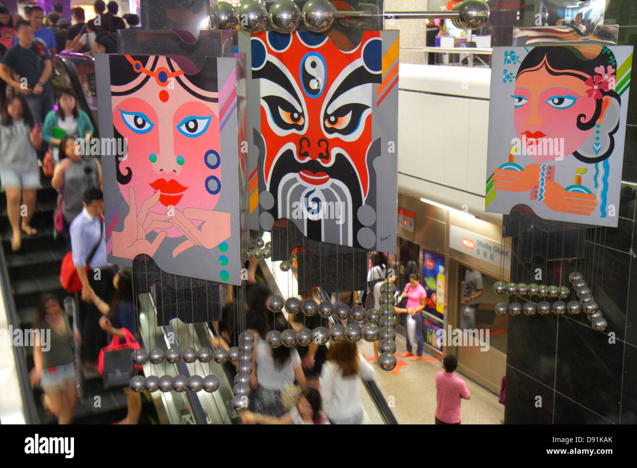 Singapore Dhoby Ghaut MRT Station,North South Line,subway train,riders,commuters,platform,escalator,art,Asian man men male,woman female women,Sing1302 Stock Photo