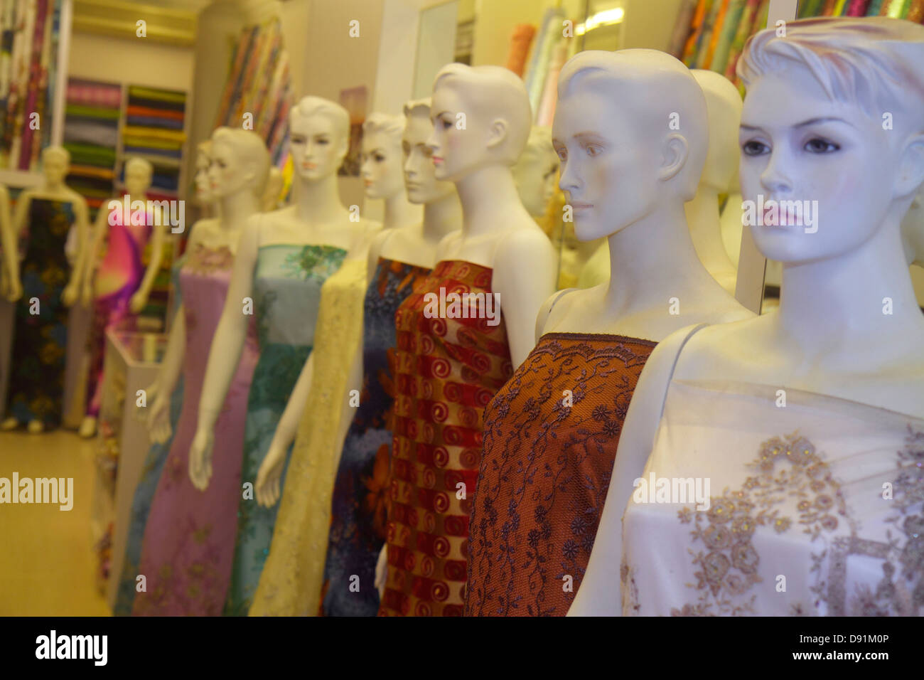 Singapore,Kampong Glam,Muslim Quarter,Arab Street,textile,merchant,fabric,for display sale female,mannequins,dresses,shopping shopper shoppers shop sh Stock Photo