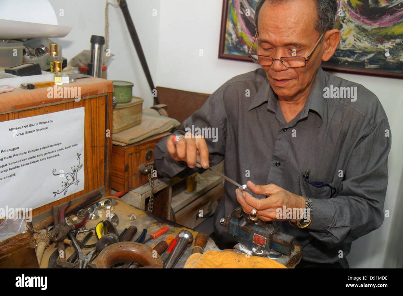 Singapore Kampong Glam,Muslim Quarter,North Bridge Road,Asian man men male,jewelry,jewellery,maker,ring,tools,file,clamp,work station,skill,craftsman, Stock Photo