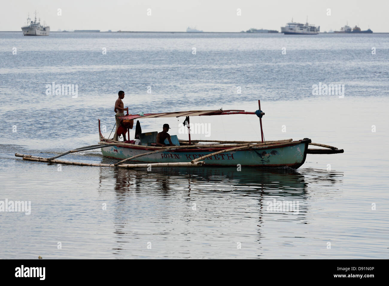 Traditional Outrigger Boat in Manila Bay, Philippines Stock Photo