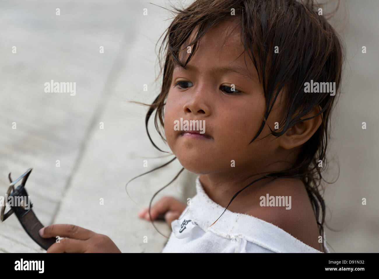 Portrait of a Little Girl in the Street of Manila, Philippines Stock Photo