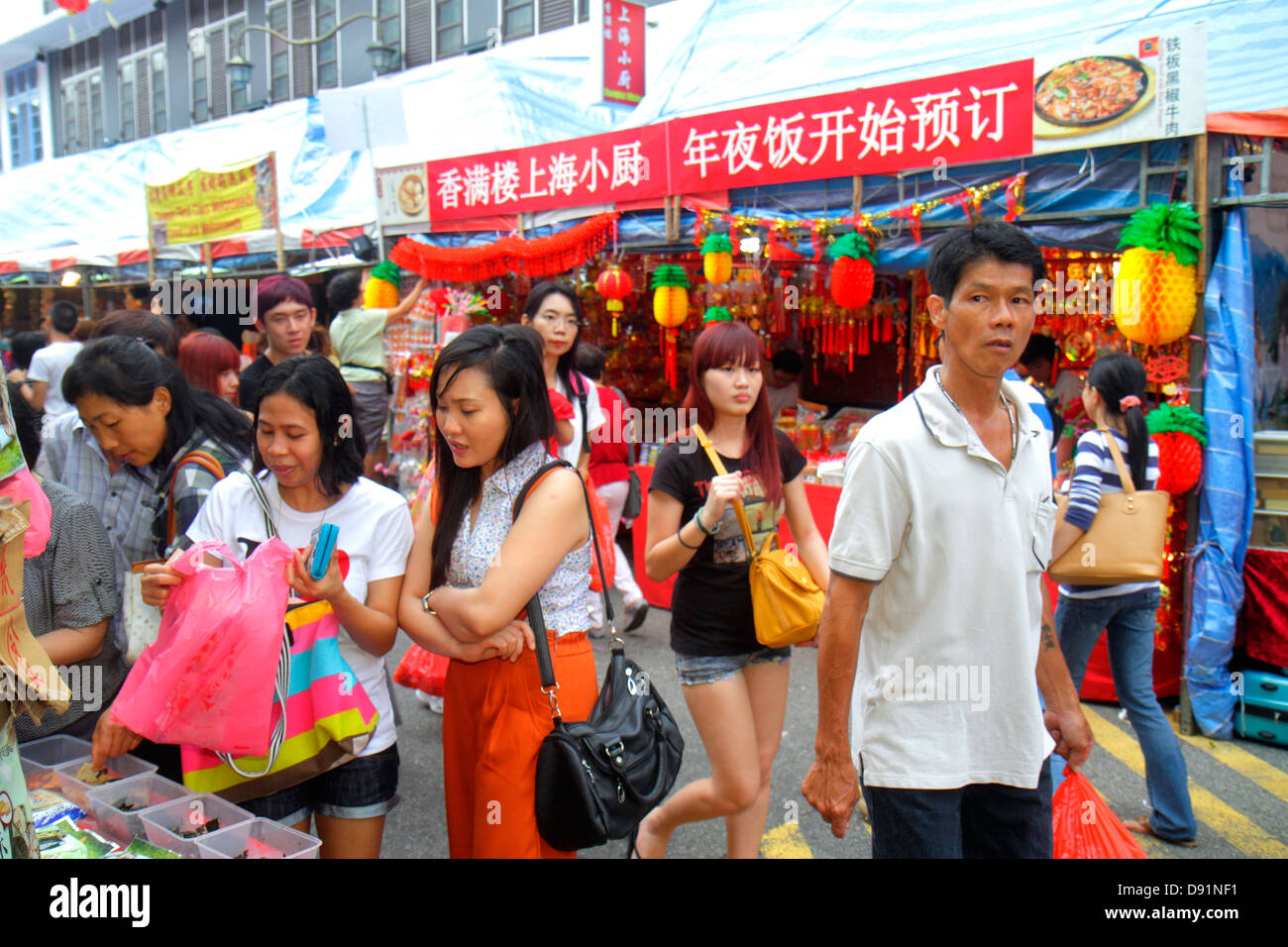 Singapore,Chinatown,shopping shopper shoppers shop shops market markets marketplace buying selling,retail store stores business businesses,Asian woman Stock Photo