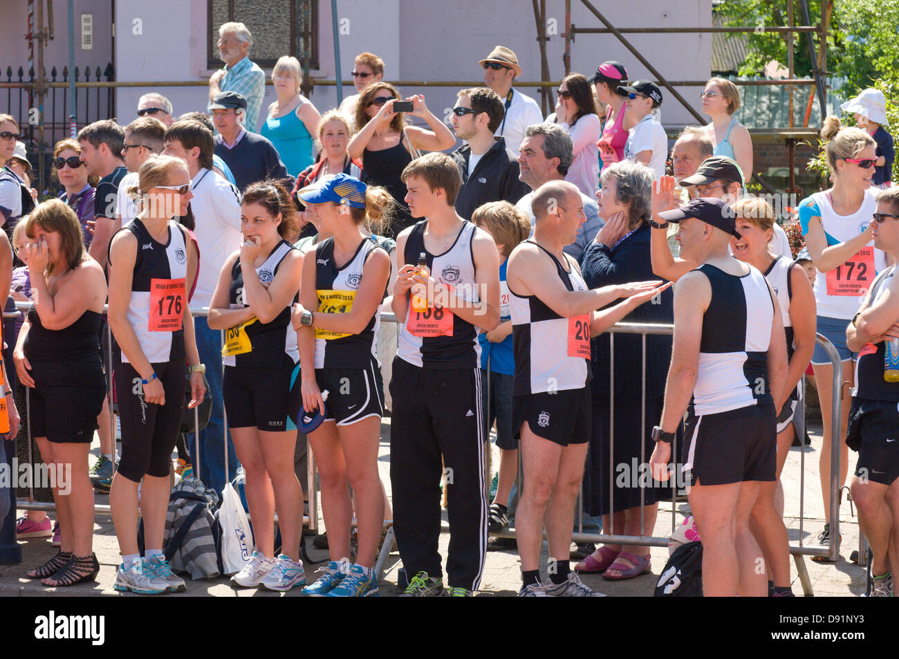 Llanwrtyd Wells, UK. 8th June 2013. Competitors wait for the Start. Over 400 runners compete against 65 horses in the Man V Horse 23 mile marathon, over gruelling mountainous terrain.The event was conceived by Gordon Green at his pub the Neuadd Arms in 1980 upon overhearing a discussion whether a man was equal to a horse running cross country over distance. The cash prize for beating a horse was increased each year by £1,000 until Huw Lobb won £25,000 in 2004 beating the first horse by 2 mins with a time of 2:05:19. Credit: Graham M. Lawrence/Alamy Live News. Stock Photo