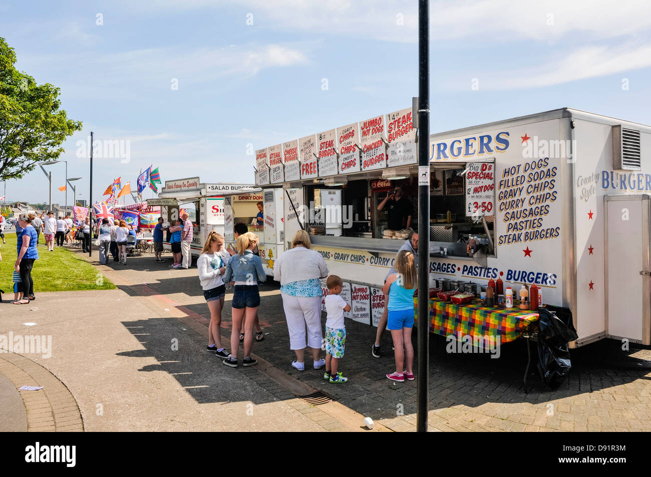 Mobile fast food vans at an outdoor event Stock Photo - Alamy