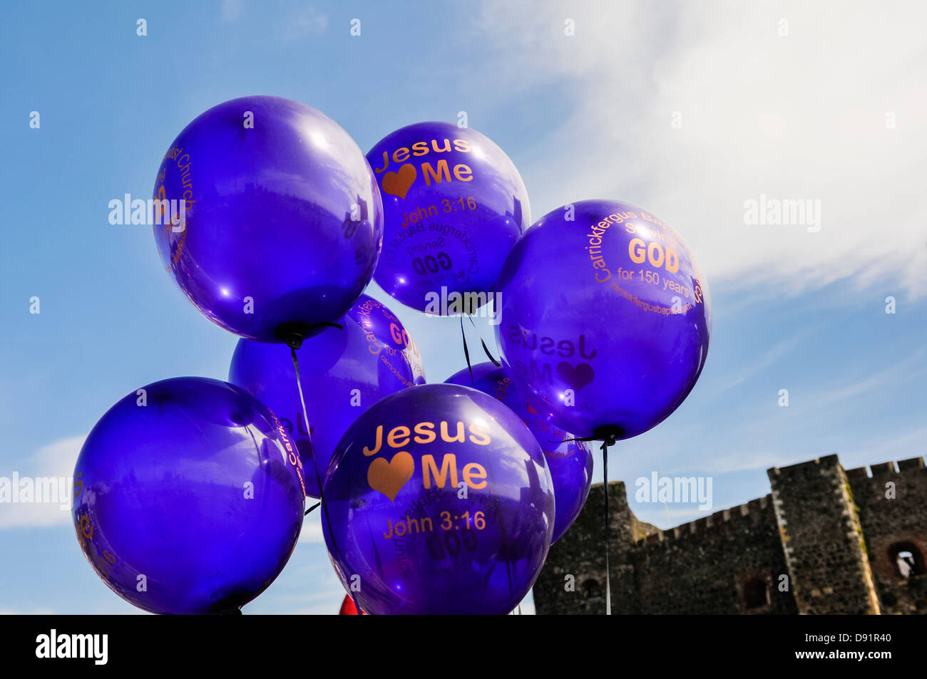 Helium balloons saying 'Jesus Loves Me', John 3:16 Stock Photo