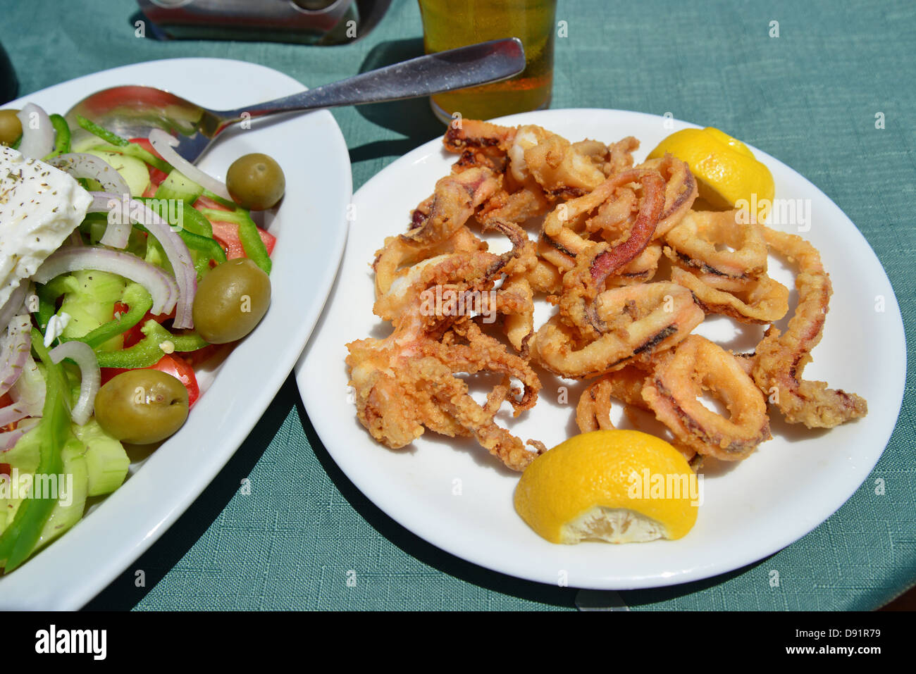 Greek salad and calamari in taverna, Halki (Chalki), Rhodes (Rodos) Region, The Dodecanese, South Aegean Region, Greec Stock Photo