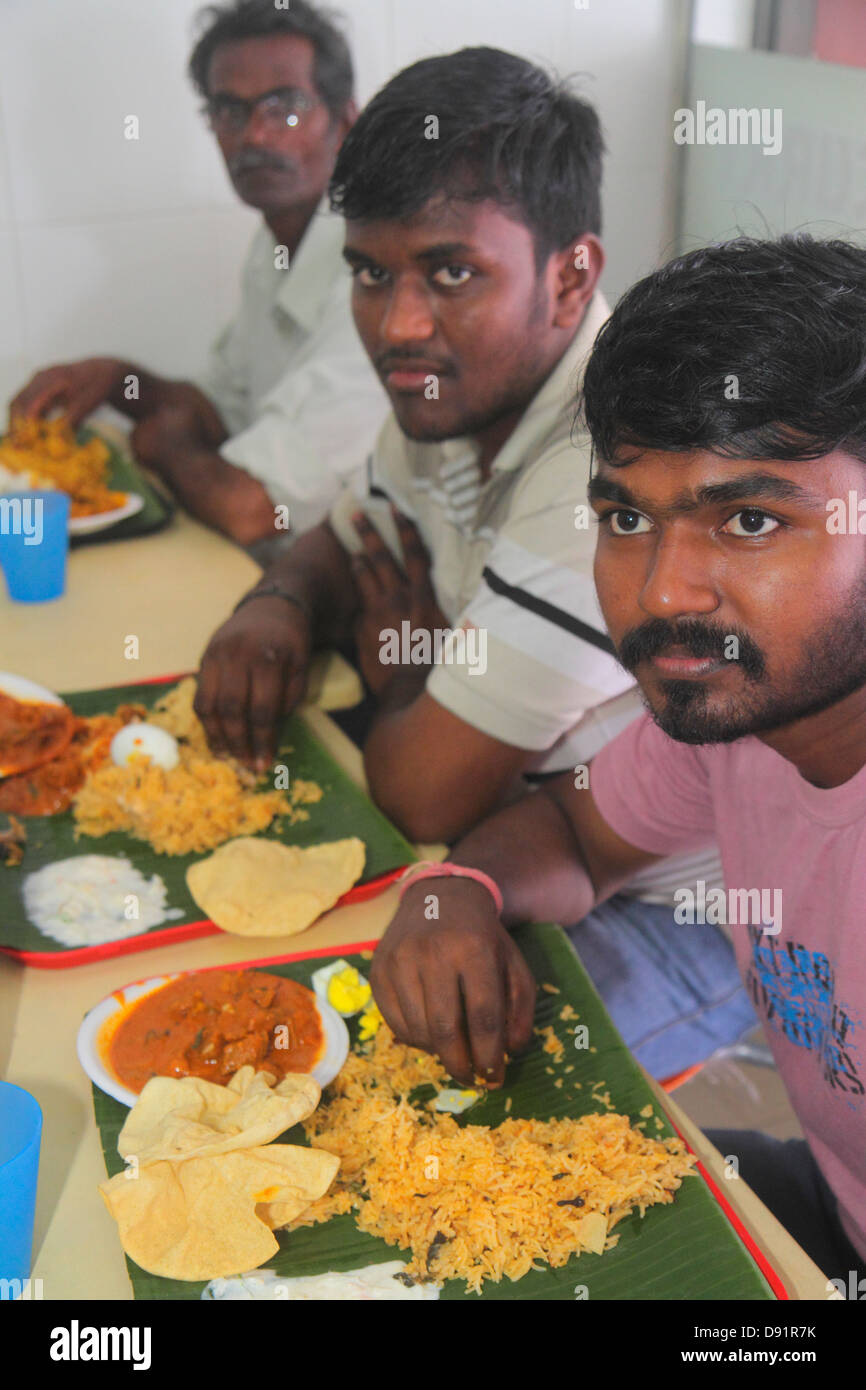 Singapore Little India,Veerasamy Road,restaurant restaurants food dining cafe cafes,Indian,eating with hand,hands,Asian man men male,banana leaf tray, Stock Photo