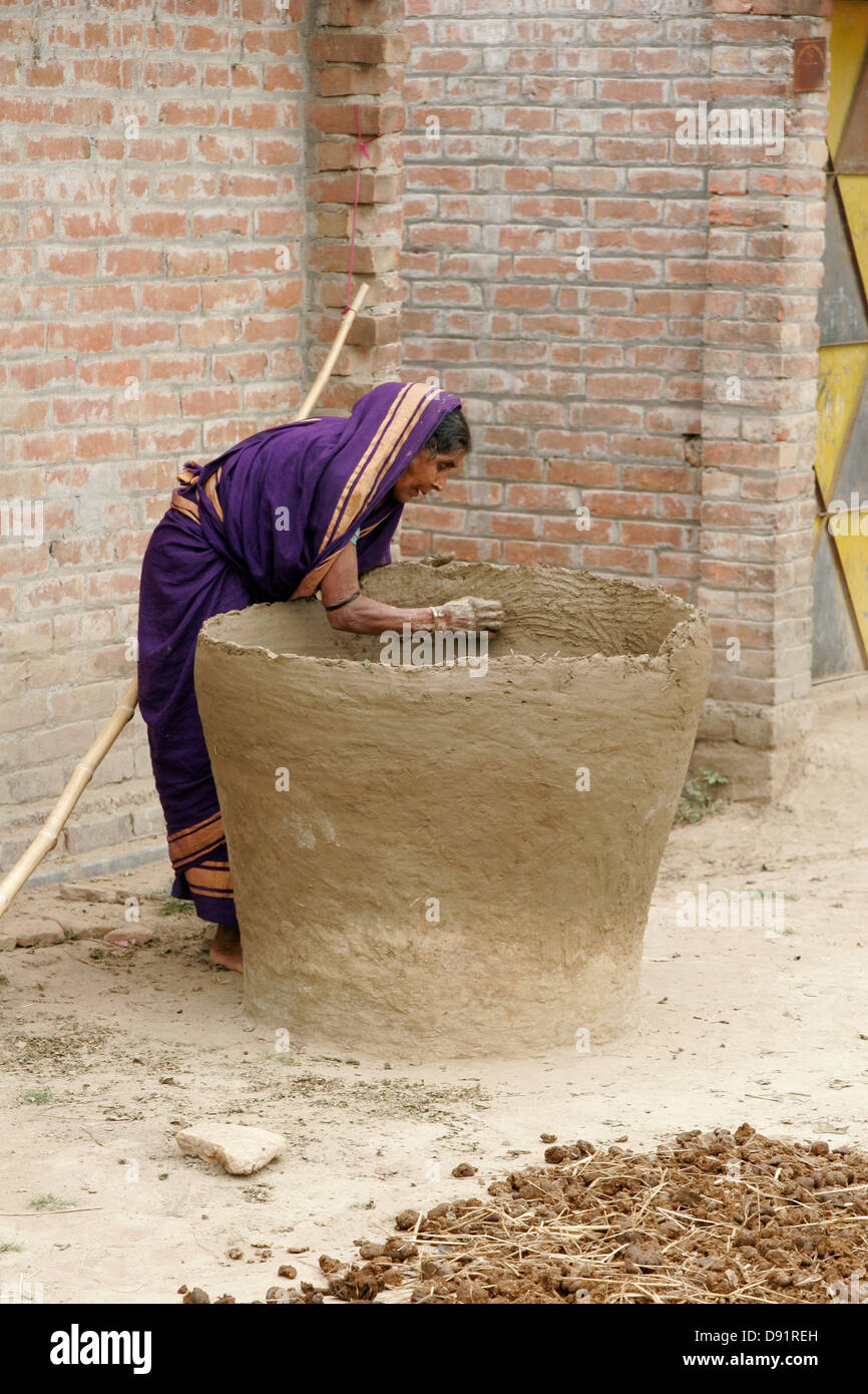 Woman making giant jar in her courtyard, Bangladesh Stock Photo Alamy