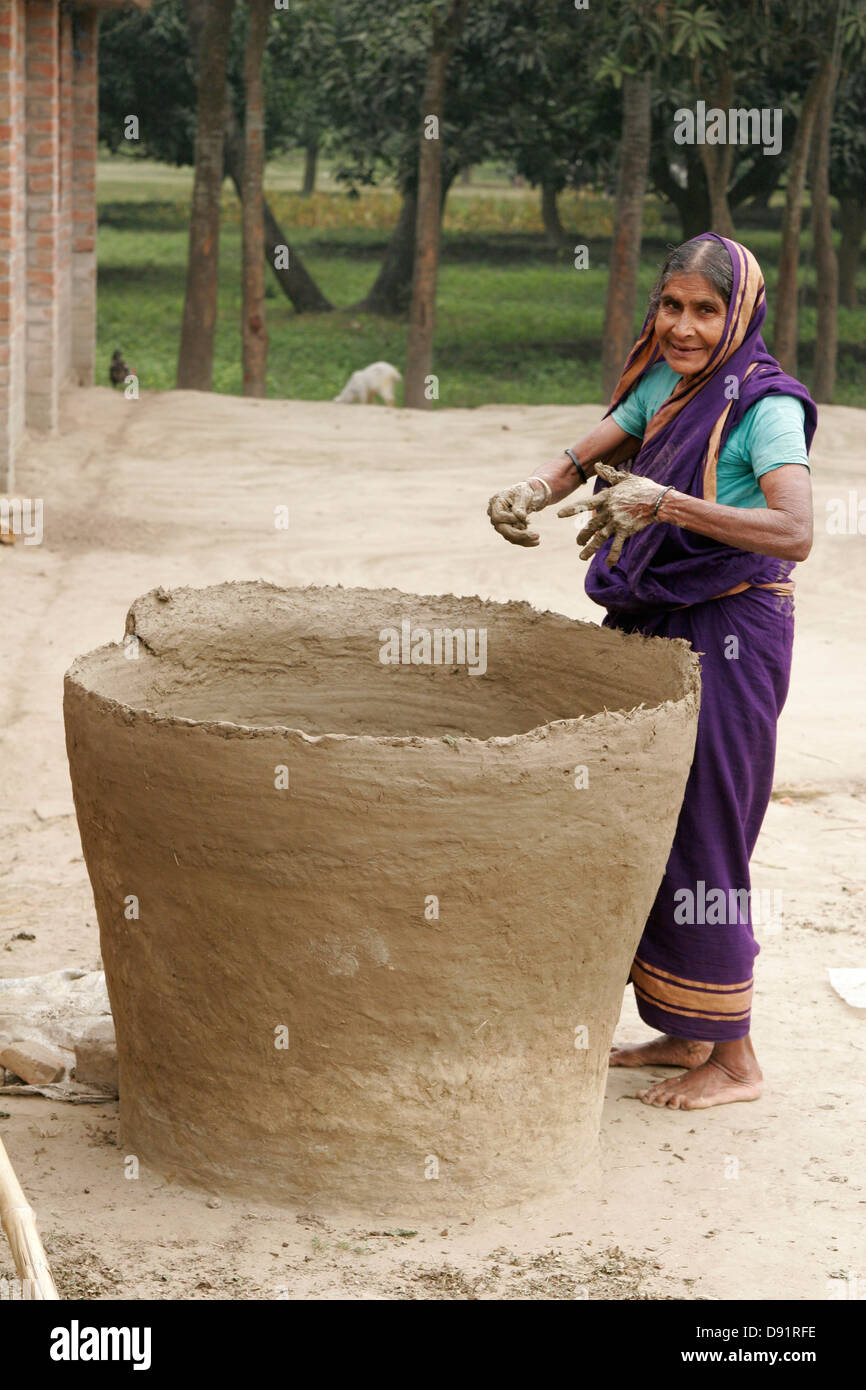 Woman making giant jar in her courtyard, Bangladesh Stock Photo Alamy