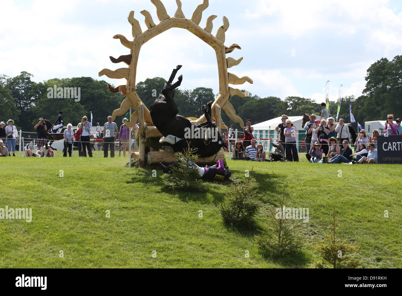 Leeds Bramham UK. 8th June 2013. Jolyse Clancey (GBR) riding On Stage II is involved in a dramatic fall during the cross country event at the 40th Bramham horse trials, both horse and rider were not seriously injured. Credit: S D Schofield/Alamy Live News Stock Photo