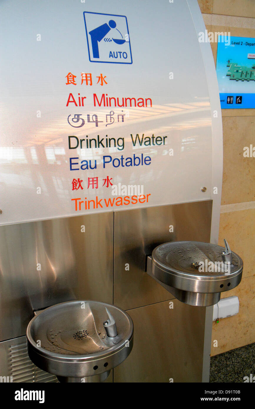 Singapore Changi International Airport,SIN,terminal,interior inside,water fountain,drink drinks drinking,hanzi characters,Chinese,Sing130206070 Stock Photo