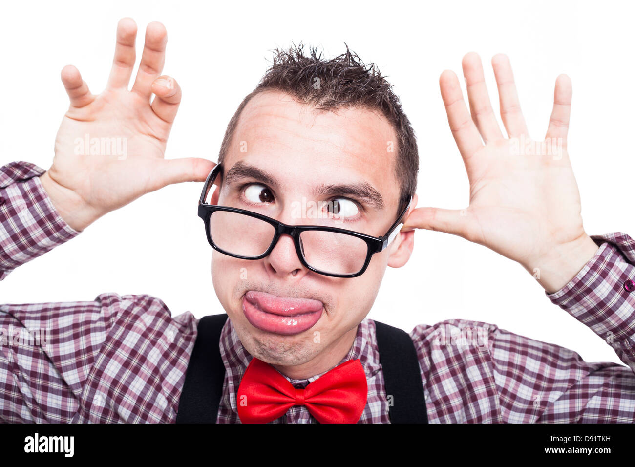 Silly cross-eyed nerd man making funny face, isolated on white background Stock Photo
