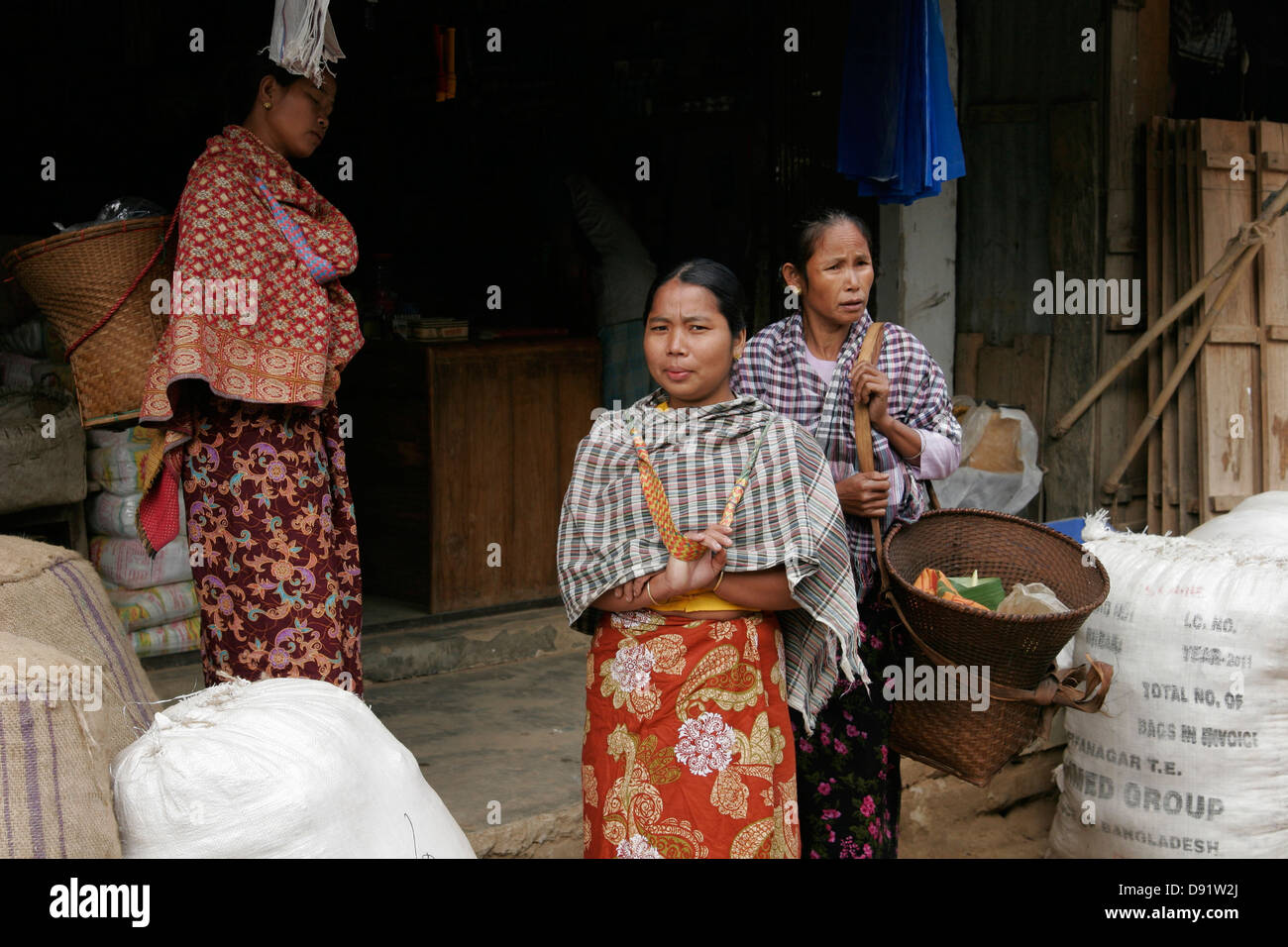 Tribal women with woven basket on the vegetable market in Ruma Bazaar, Chittagong Hill Tracts, Bangladesh Stock Photo