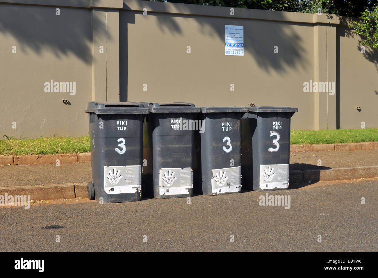 A group of four rubbish bins on a road in Johannesburg Stock Photo Alamy