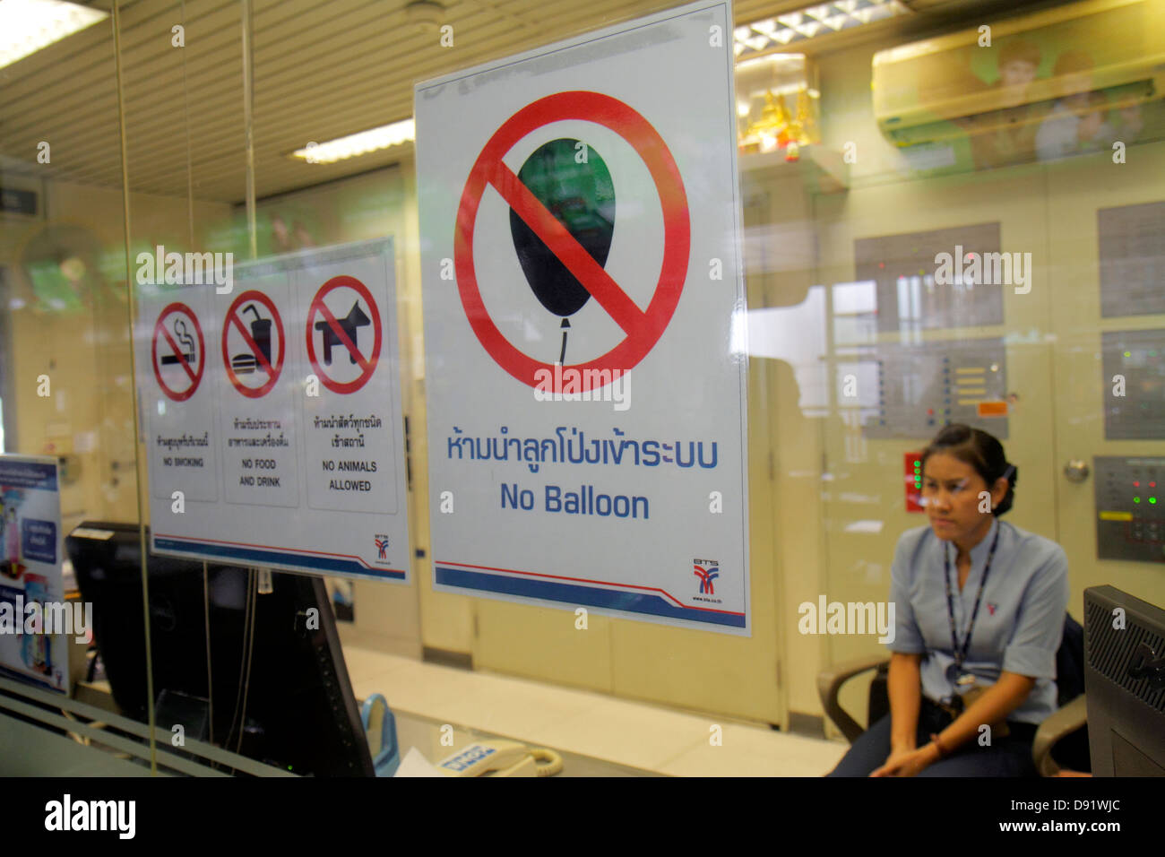 Thailand,Thai,Bangkok,Pathum Wan,Phaya Thai Station,Bangkok Mass Transit System,BTS Skytrain,sign,no animals,balloons,Asian woman female women,employe Stock Photo