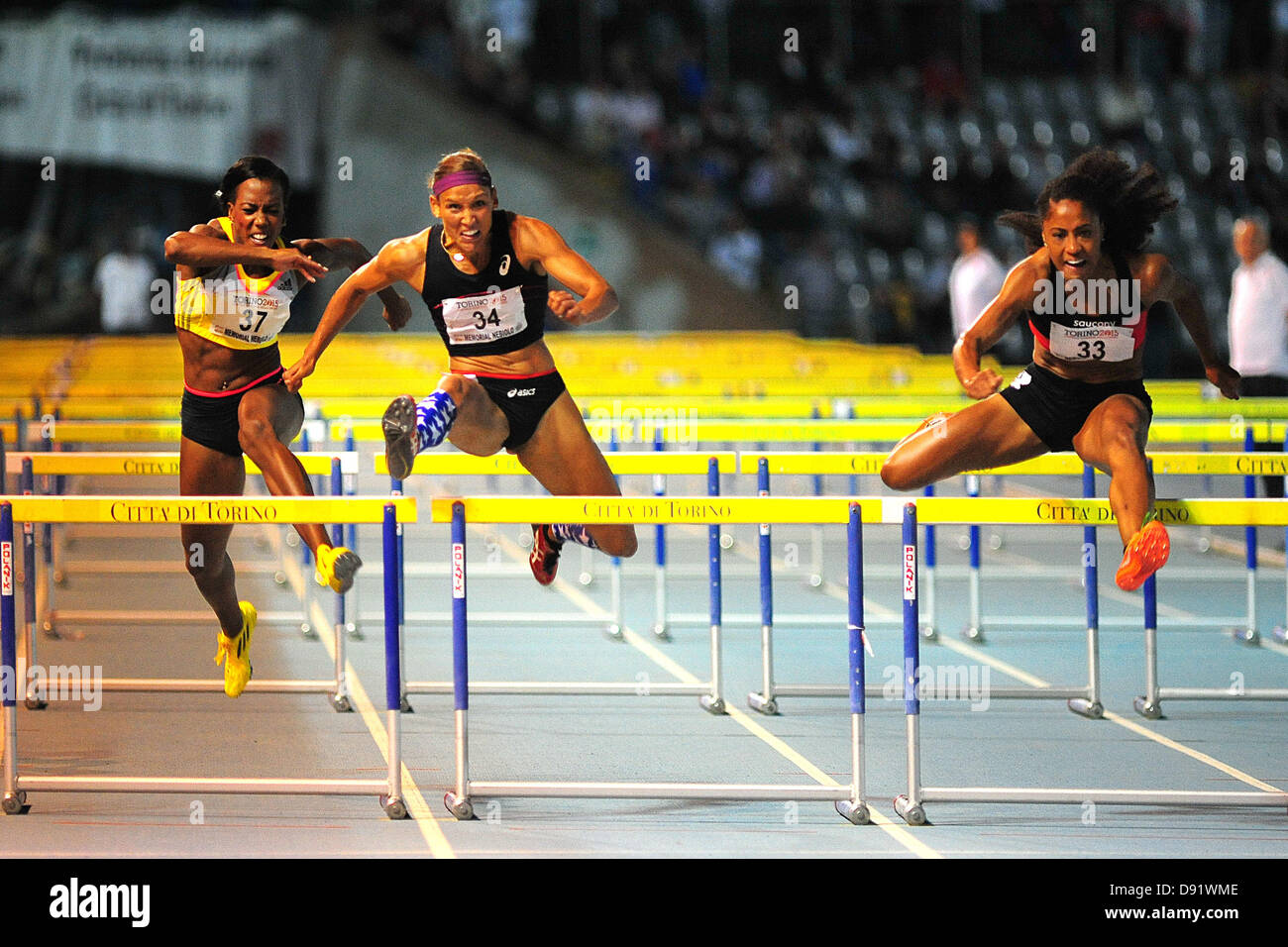 08.06.2013 Torino, Italy. Queen Harrison of the USA wins the Womens 100m hurdles before Lolo Jones of the USA and Tiffany Porter of England during the International Athletics meeting Memorial Primo Nebiolo from the Stadio Primo Nebiolo. Stock Photo