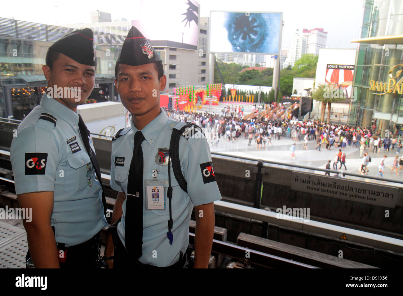 Thailand,Thai,Bangkok,Pathum Wan,Rama 1 Road,Siam Station,Bangkok Mass Transit System,BTS Skytrain,Asian man men male,security guard,guards,Siam Parag Stock Photo