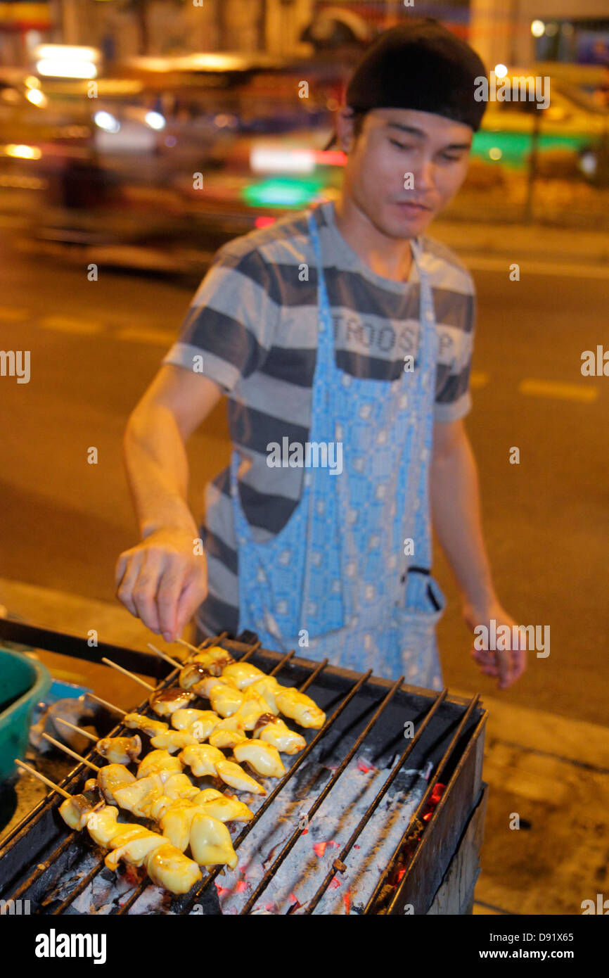 Thailand,Thai,Bangkok,Pathum Wan,Soi Kasemsan 1,Rama 1 Road,Asian man men male,night evening,street food,vendor vendors,stall stalls booth market,cook Stock Photo