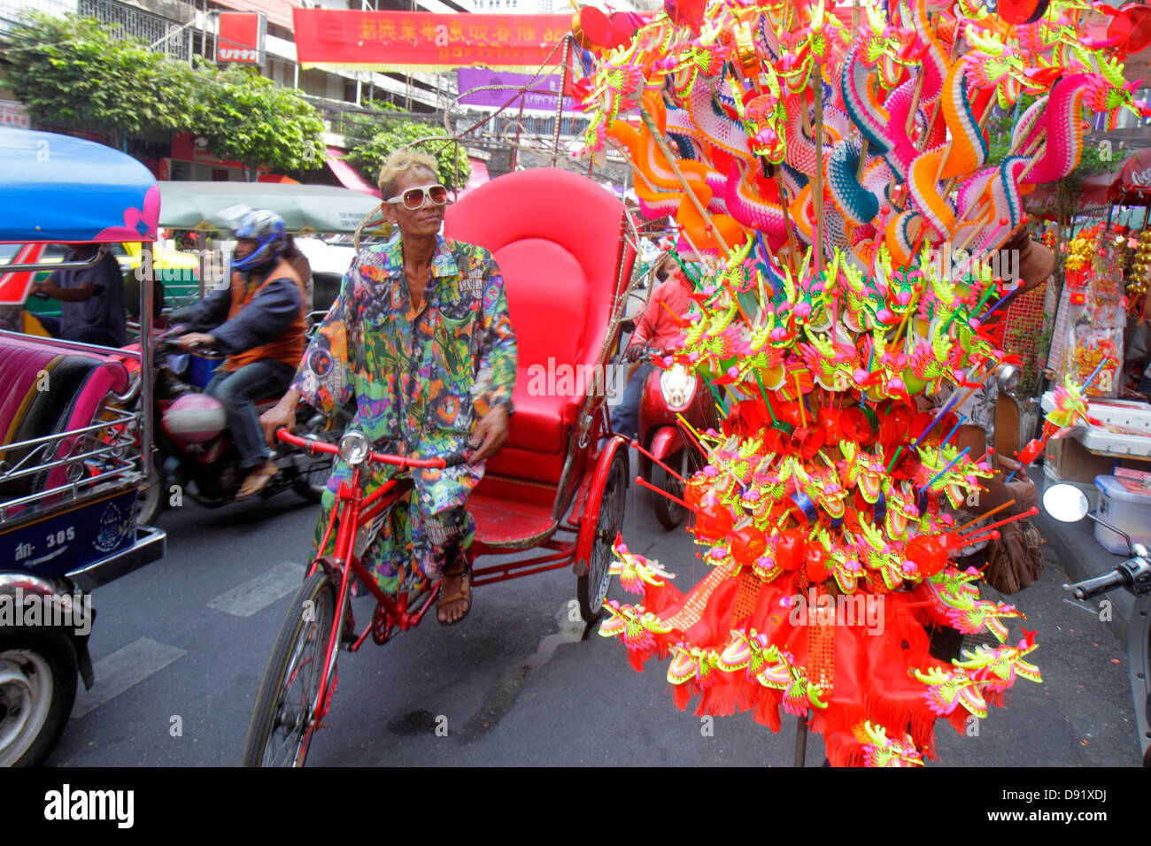 Bangkok Thailand,Thai,Samphanthawong,Chinatown,Yaowarat Road,traffic,taxi,auto rickshaw,tuk-tuk,sam-lor,banners,Chinese New Year,Asian man men male,pe Stock Photo